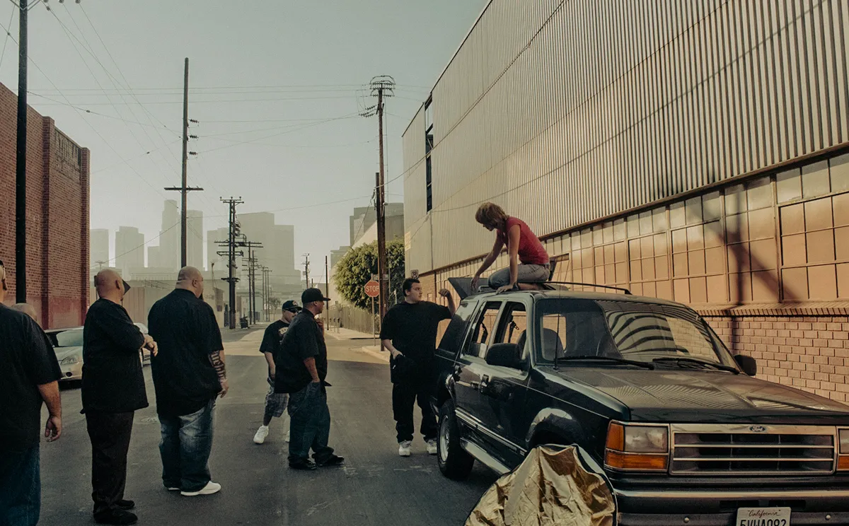 Photographer Janina Laszlo on set on the roof of an SUV, shooting for Suspect Entertainment in Los Angeles — behind the scenes with the German commercial and editorial photographer