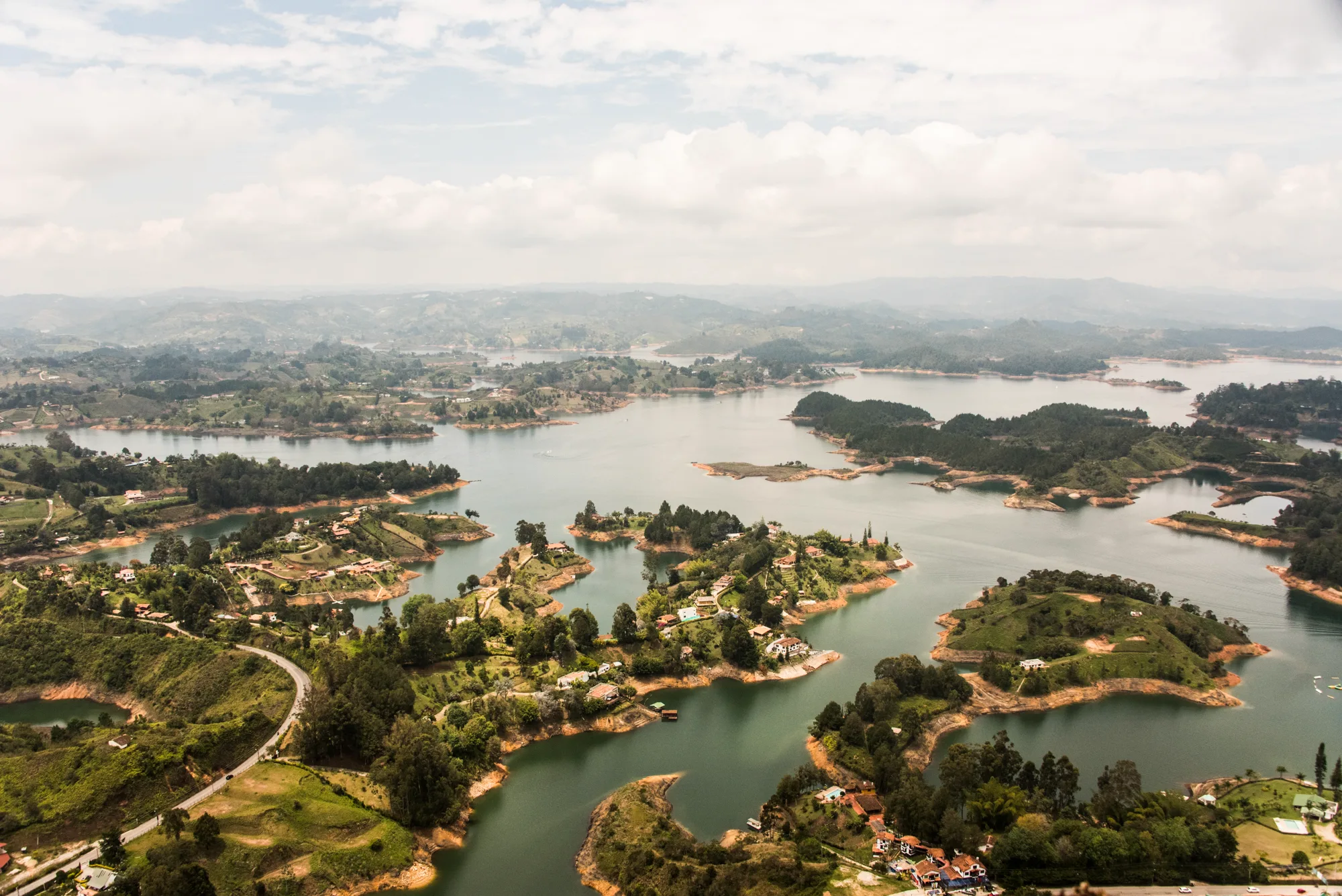 View from El Peñol over the islands and bays of the Guatapé reservoir — Colombia, travel and documentary photography by Janina Laszlo