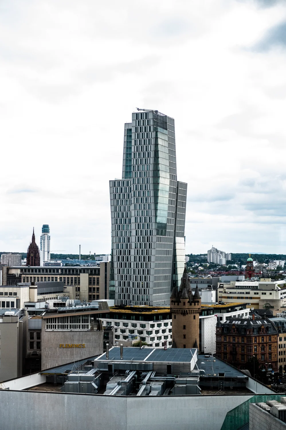 Frankfurt skyline with the Palais Quartier tower and the medieval Eschenheimer Turm, seen from the Digital+ office, Frankfurt am Main — Digital+, corporate photography by Janina Laszlo