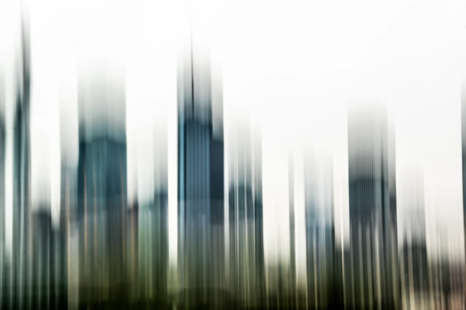 Frankfurt skyline dissolved into vertical motion blur, intentional camera movement, Frankfurt am Main — Digital+, corporate photography by Janina Laszlo