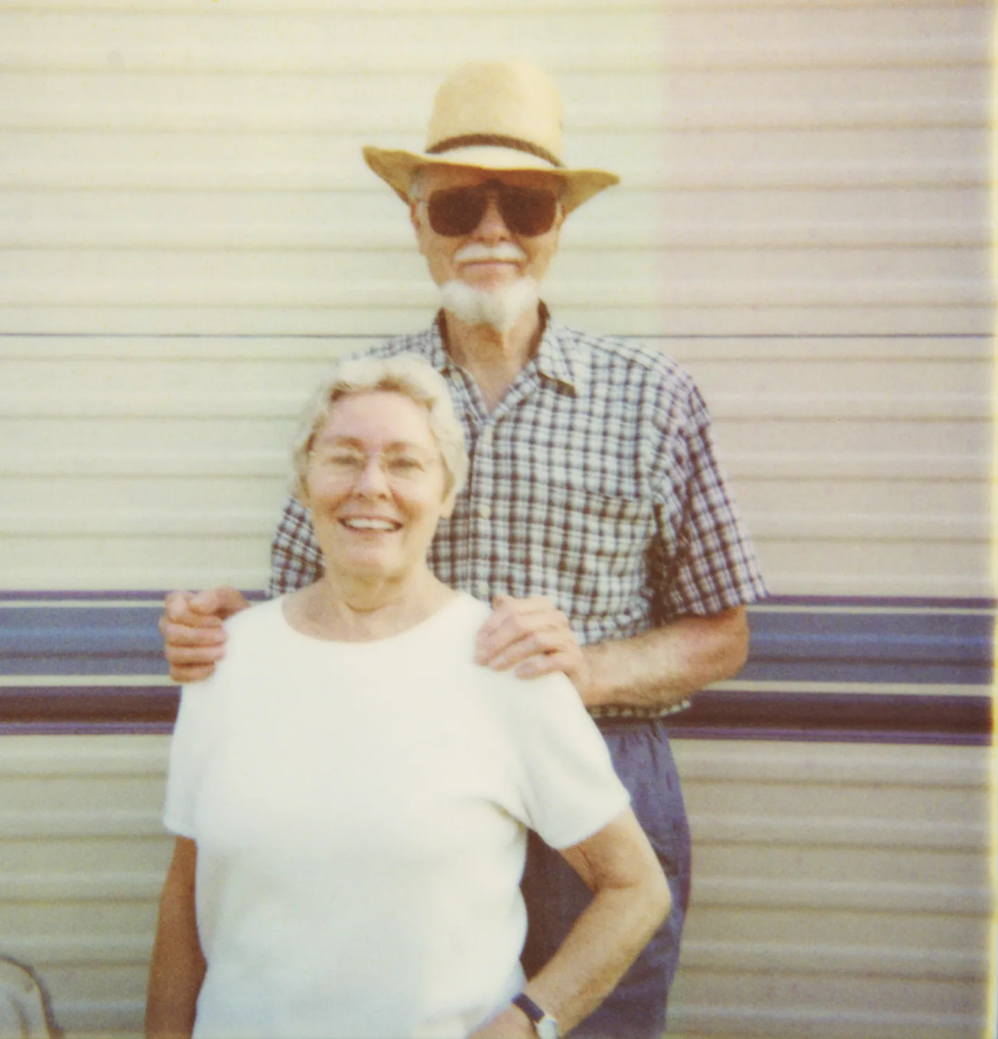 Retired couple in front of their trailer, man in straw hat — Expired Polaroids in Florida, fine art and analog photography by Janina Laszlo