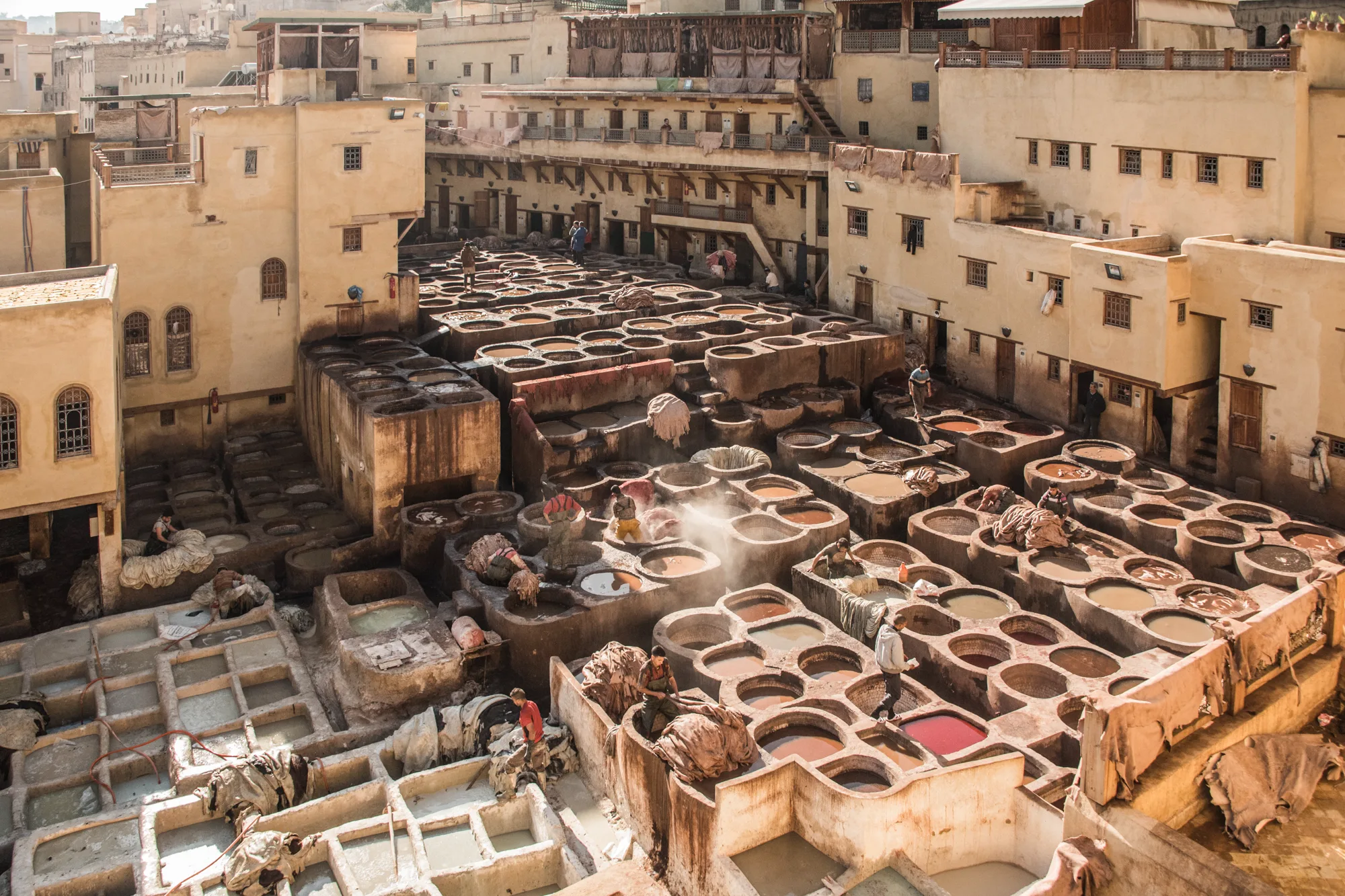 Chouara Tannery with its honeycomb of dye pits and tanners at work, Fez — Fez, street and travel photography by Janina Laszlo
