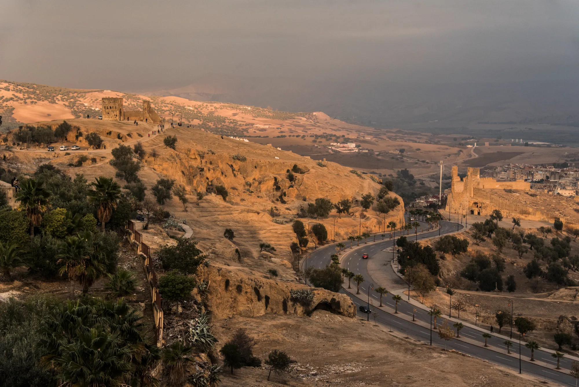 Evening light on the Marinid Tombs and the road below the hills, Fez — Fez, street and travel photography by Janina Laszlo