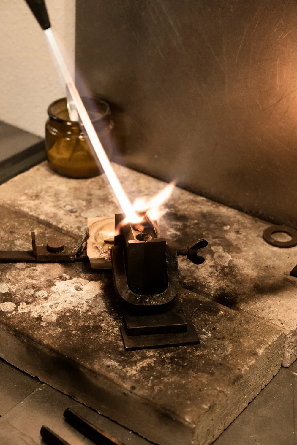 Gas torch flame melting metal in a crucible — goldsmith Gerd Weickmann — reportage by Janina Laszlo, photographer in Munich