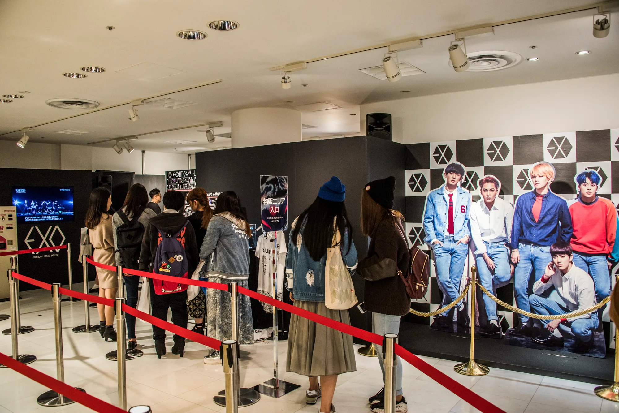 Fans queuing at a K-pop exhibition with life-size cut-outs, Tokyo — Japan, travel and street photography by Janina Laszlo