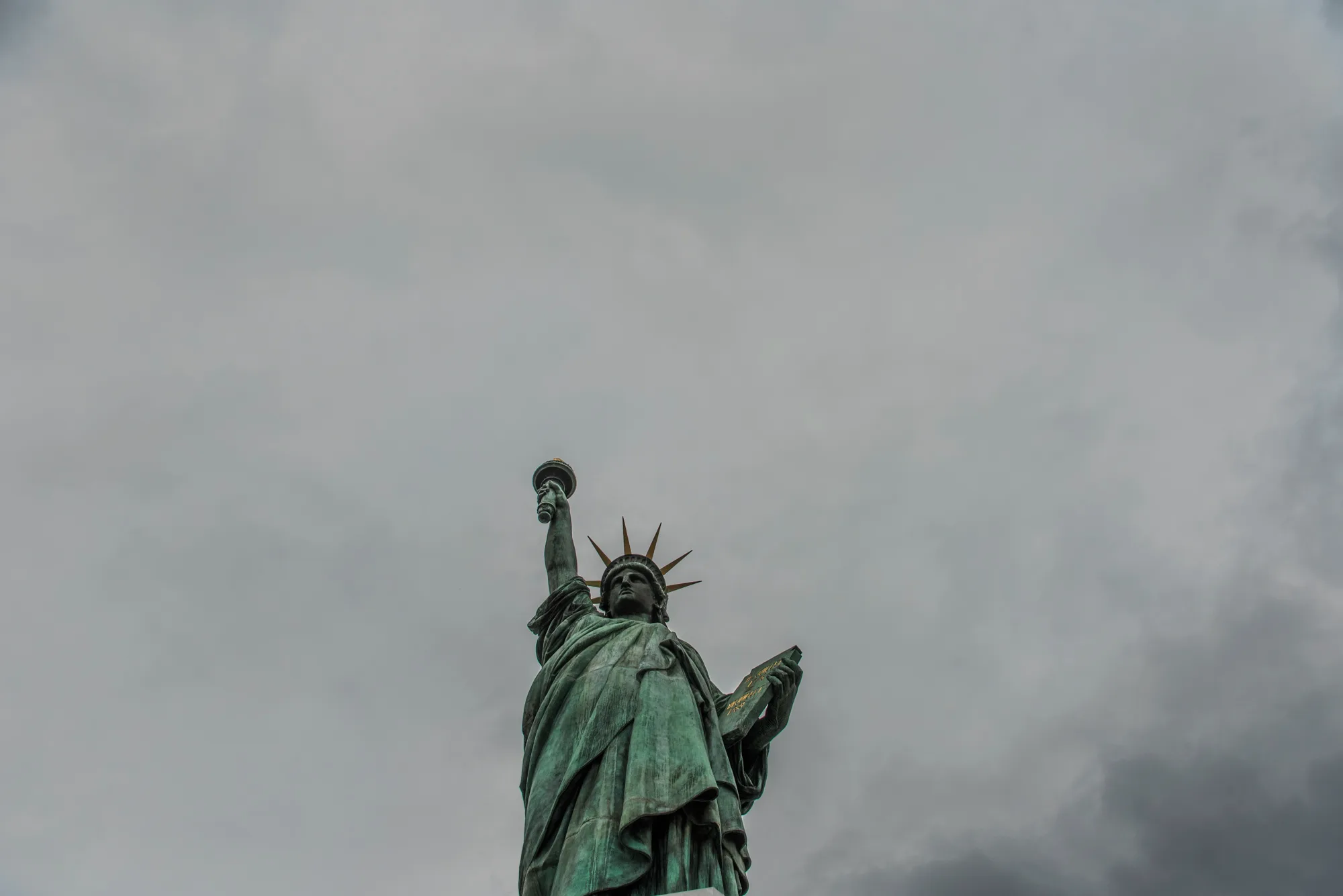 Statue of Liberty replica against a grey sky, Odaiba, Tokyo — Japan, travel and street photography by Janina Laszlo