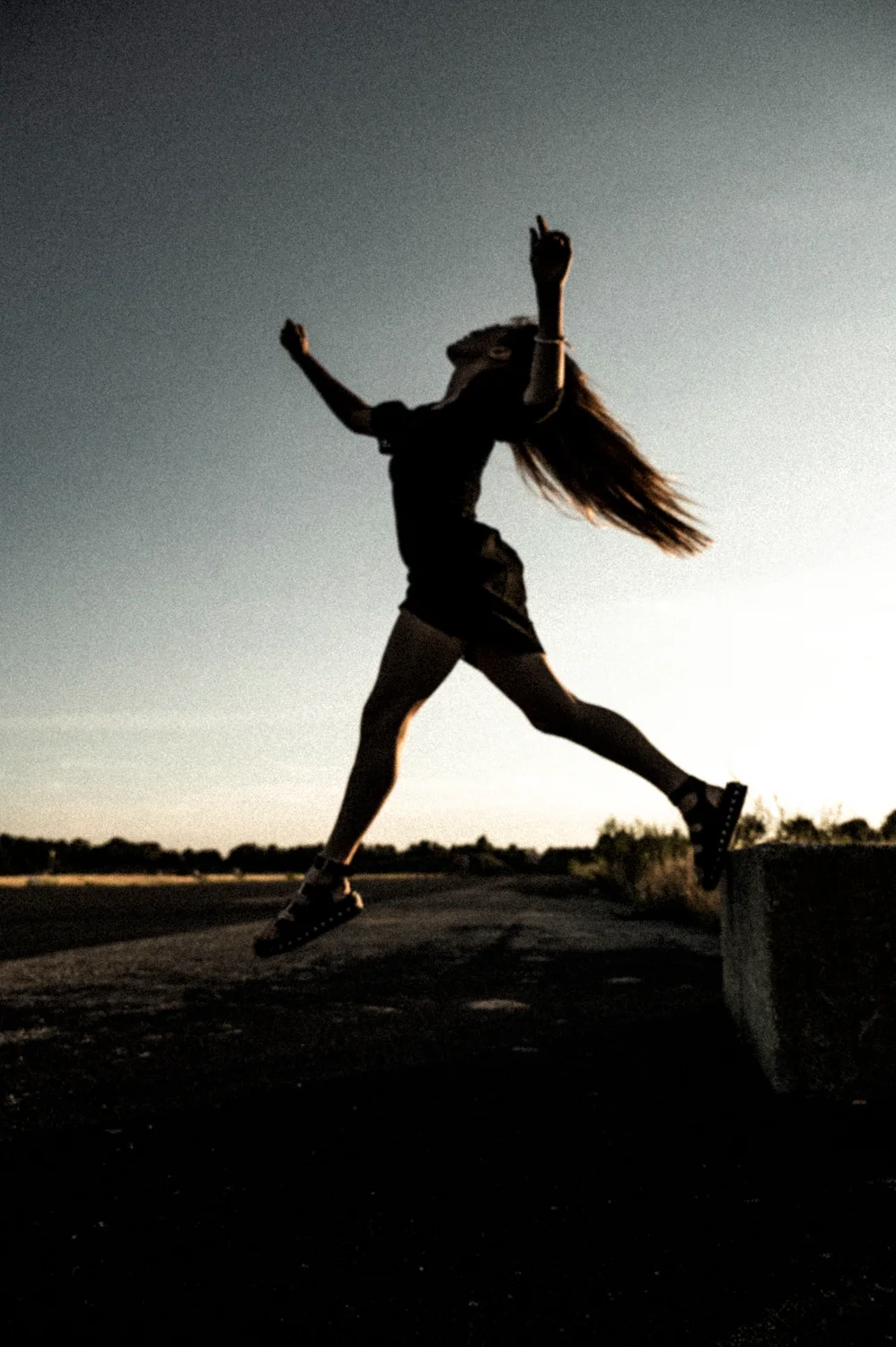 Julia leaping against the evening sky — Julia, dance portrait photography by Janina Laszlo