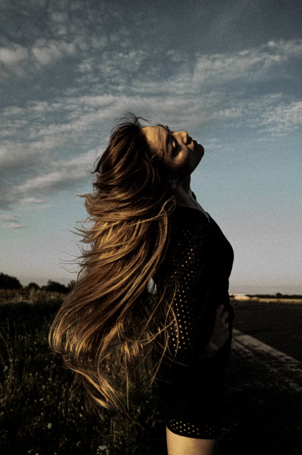 Julia throwing her long hair against the sky — Julia, dance portrait photography by Janina Laszlo