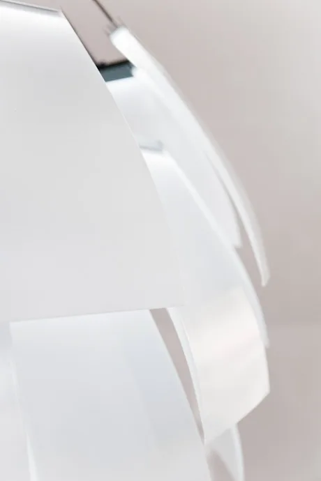 Overlapping white blades of the LC 1.0 chandelier, soft side light — LC 1.0 chandelier by Denise M. Hachinger, product and design photography by Janina Laszlo