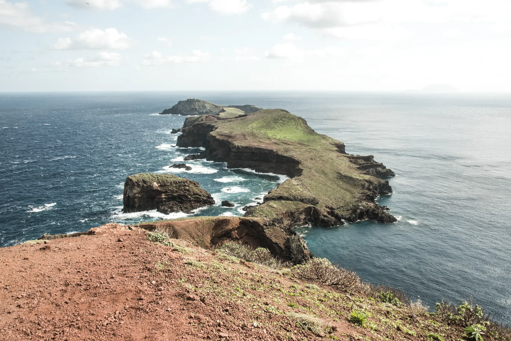 Ponta de São Lourenço peninsula reaching into the Atlantic with its lighthouse islet — Madeira, landscape and travel photography by Janina Laszlo