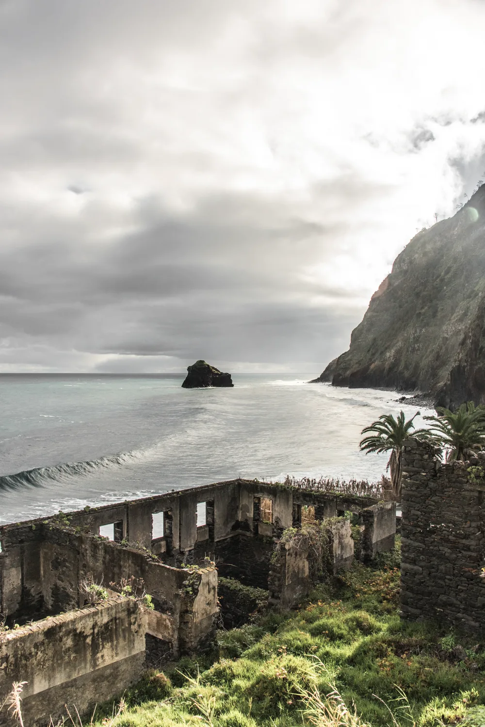 Ruins of a stone building above the sea with a sea stack and steep cliffs — Madeira, landscape and travel photography by Janina Laszlo