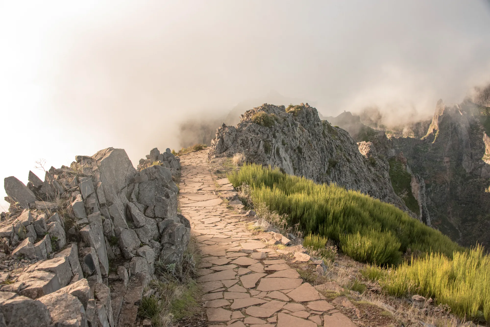 Stone-paved ridge path in drifting clouds — Madeira, landscape and travel photography by Janina Laszlo