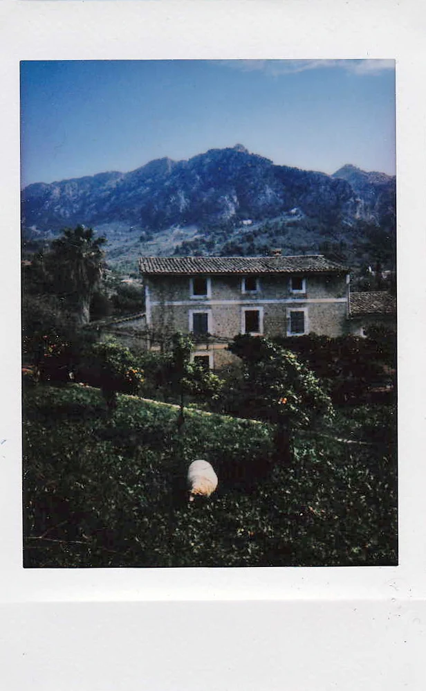 Polaroid of a stone farmhouse below the Serra de Tramuntana mountains, Mallorca — Mallorca Polaroids, analog travel photography by Janina Laszlo