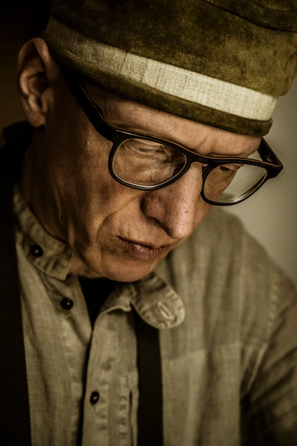 Close portrait of Martin Schleske looking down in concentration — Martin Schleske, master violin maker, editorial portrait and documentary photography by Janina Laszlo, Landsberg am Lech