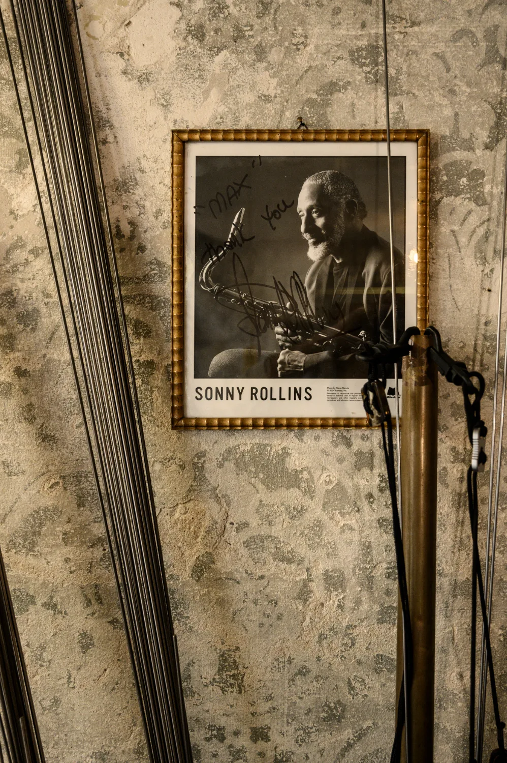 Signed portrait of Sonny Rollins on the workshop wall — Max Frei, saxophone workshop in Icking near Munich, corporate portraits and editorial photography by Janina Laszlo