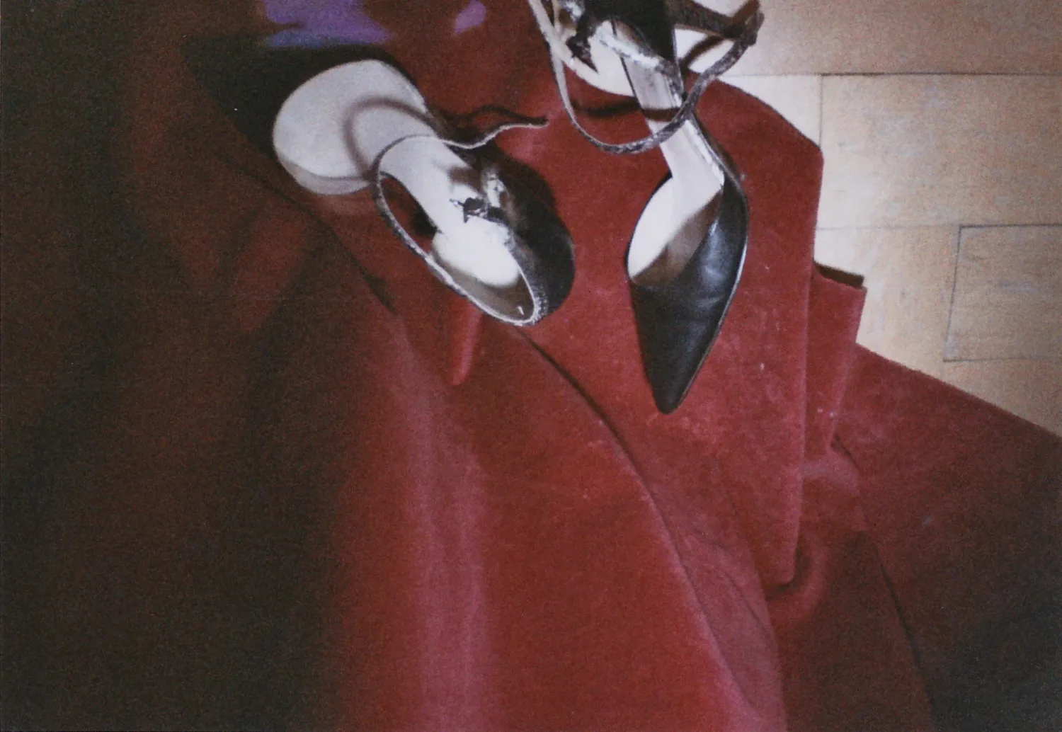 Silver high heels on a red velvet coat, detail, Na'ama Goldman series — portrait by Janina Laszlo, portrait photographer in Munich