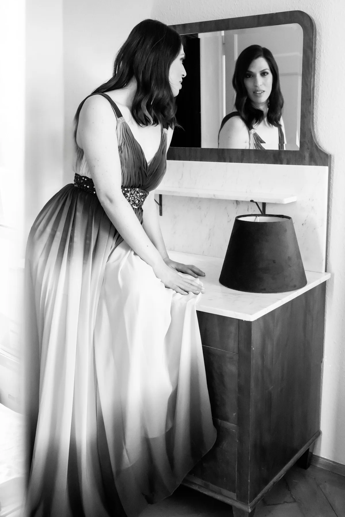 Na’ama Goldman in a ball gown at a mirror, black-and-white — Na’ama Goldman, mezzo-soprano, opera portrait photography by Janina Laszlo