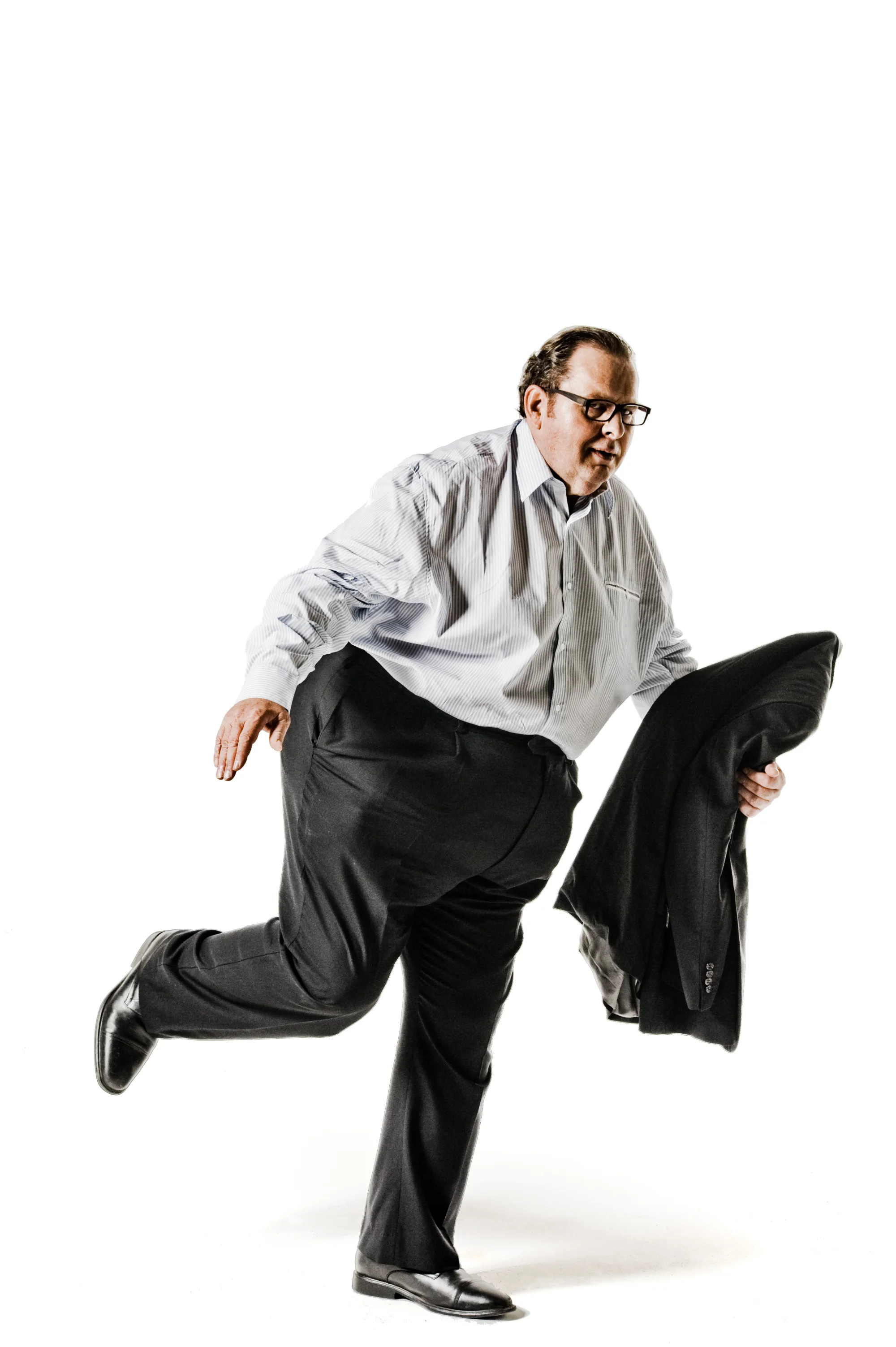 Ottfried Fischer in a playful running pose, black-and-white studio shot — Ottfried Fischer, celebrity portrait photography by Janina Laszlo