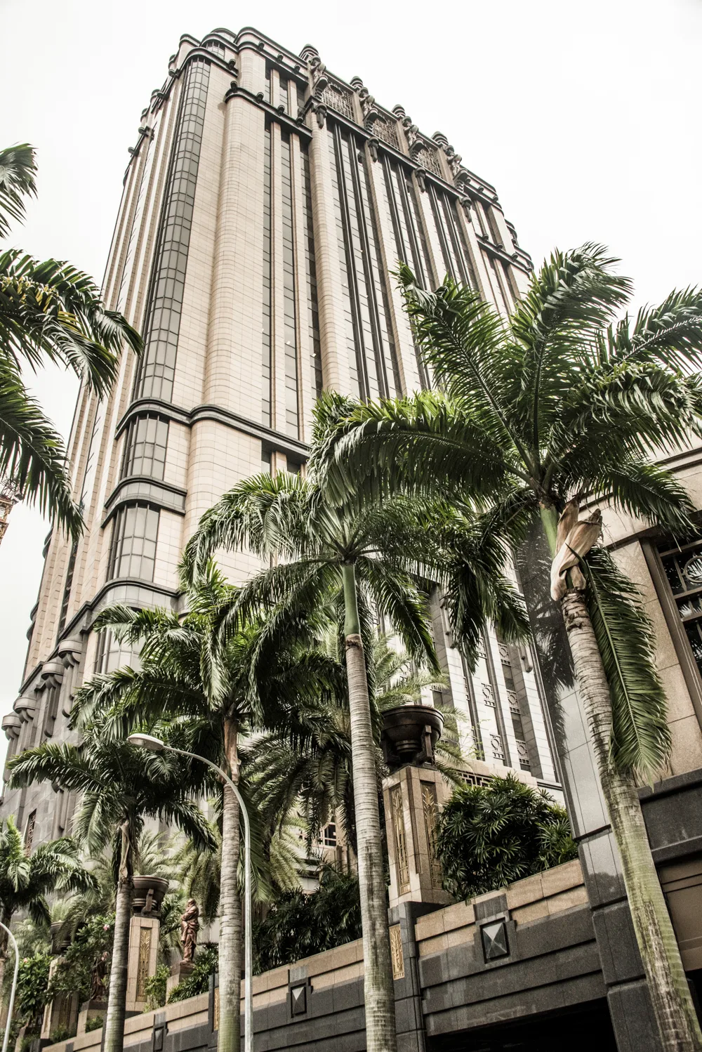 Parkview Square tower behind royal palms — Singapore, architecture and travel photography by Janina Laszlo