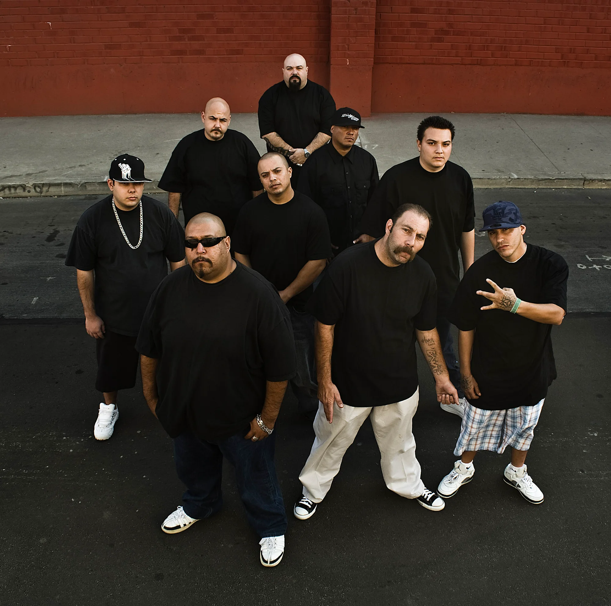 Group portrait of the Suspect Entertainment crew on a street in East Los Angeles — Suspect Entertainment, music portrait photography by Janina Laszlo