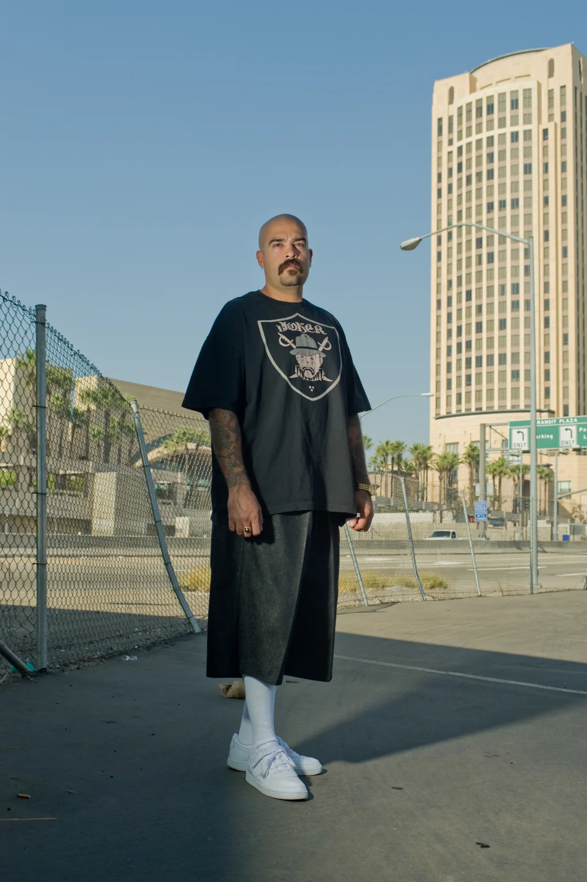 Artist standing in front of a city skyline in East Los Angeles — Suspect Entertainment, music portrait photography by Janina Laszlo