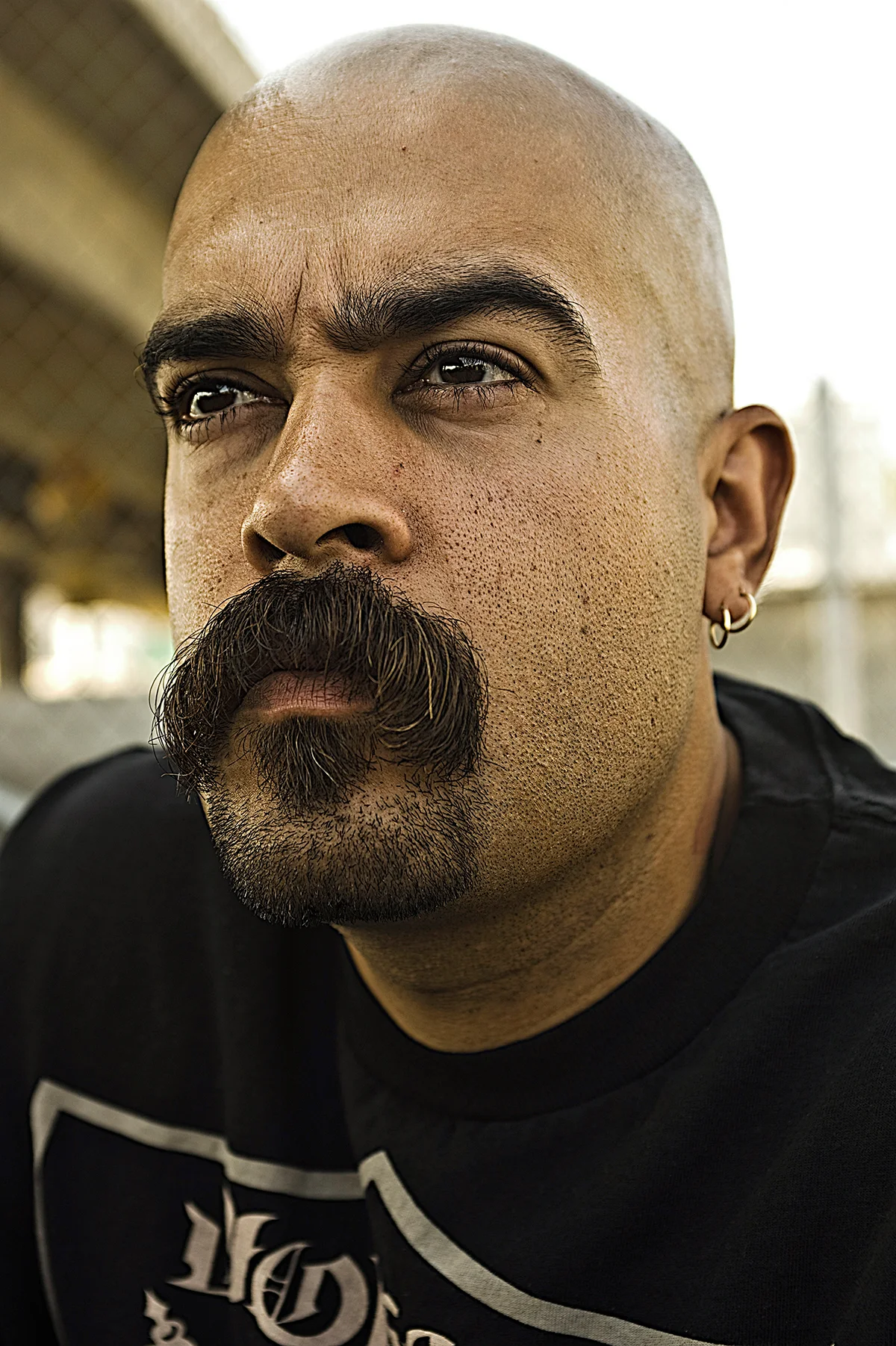 Close-up of an artist with a moustache in East Los Angeles — Suspect Entertainment, music portrait photography by Janina Laszlo