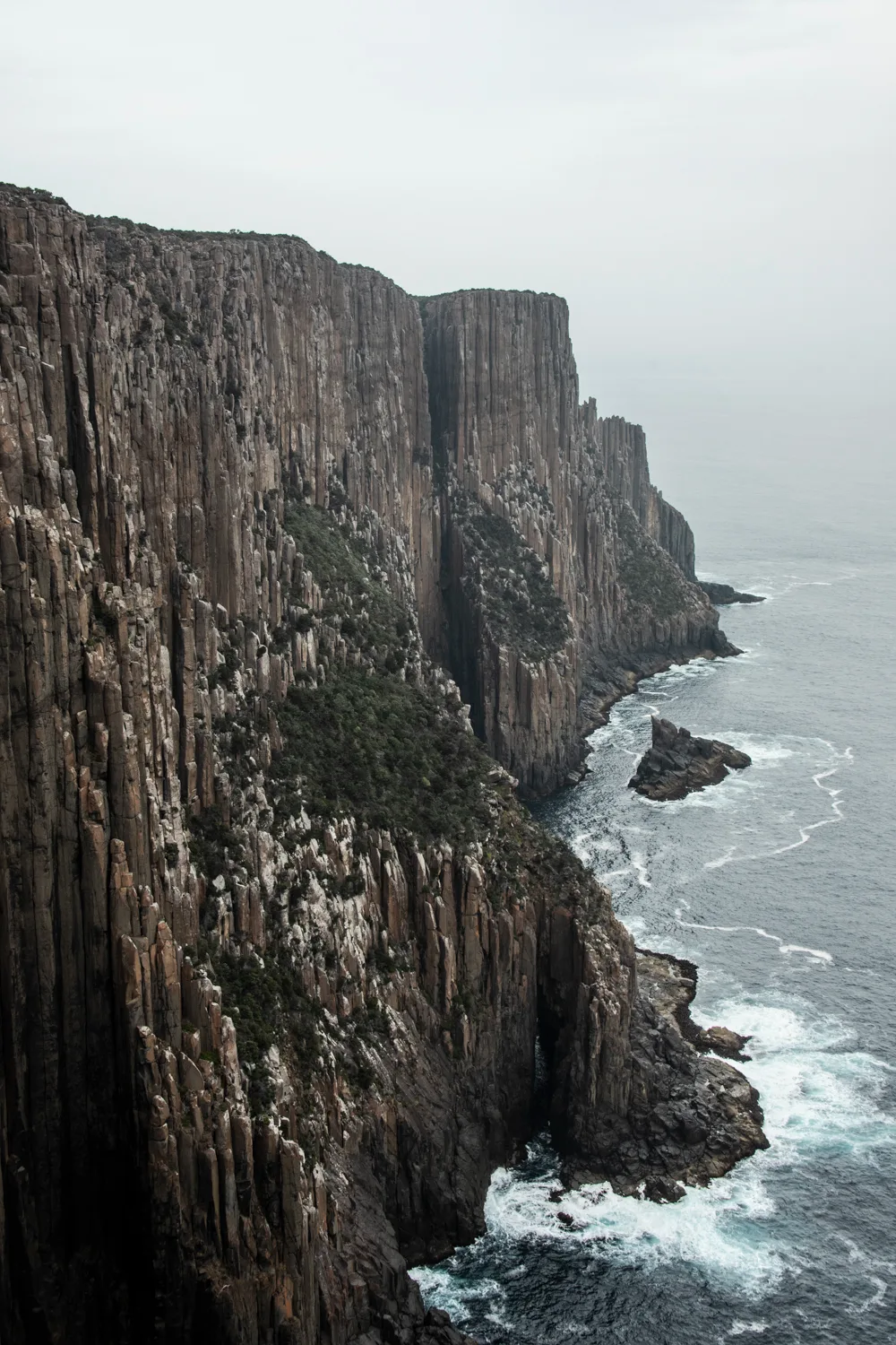 Columnar dolerite sea cliffs dropping into the Southern Ocean, Tasman Peninsula — Tasmania, landscape and travel photography by Janina Laszlo