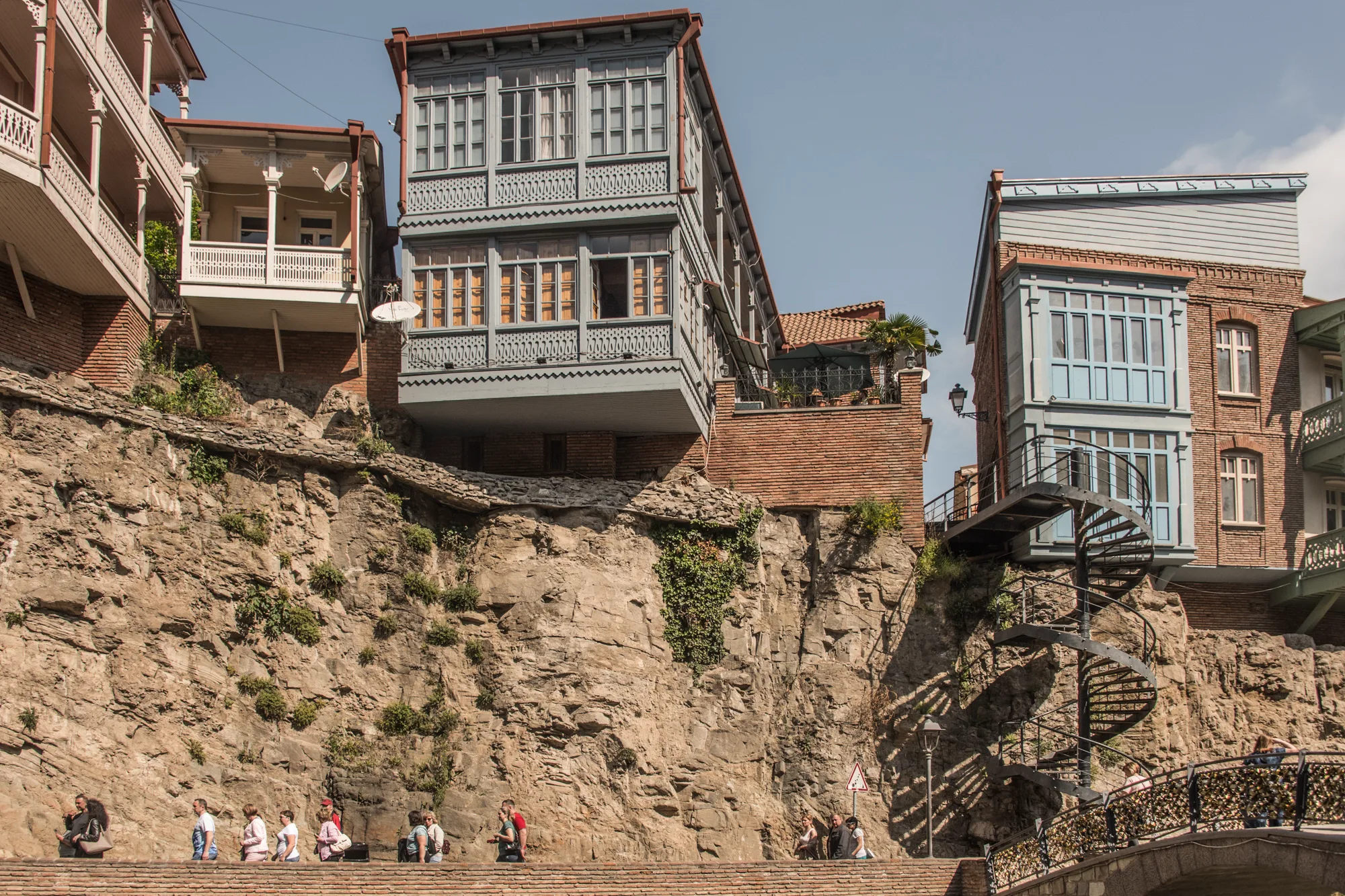 Wooden balconied houses on a cliff above the old town promenade, Tbilisi, Georgia — Travel Notes, travel photography by Janina Laszlo