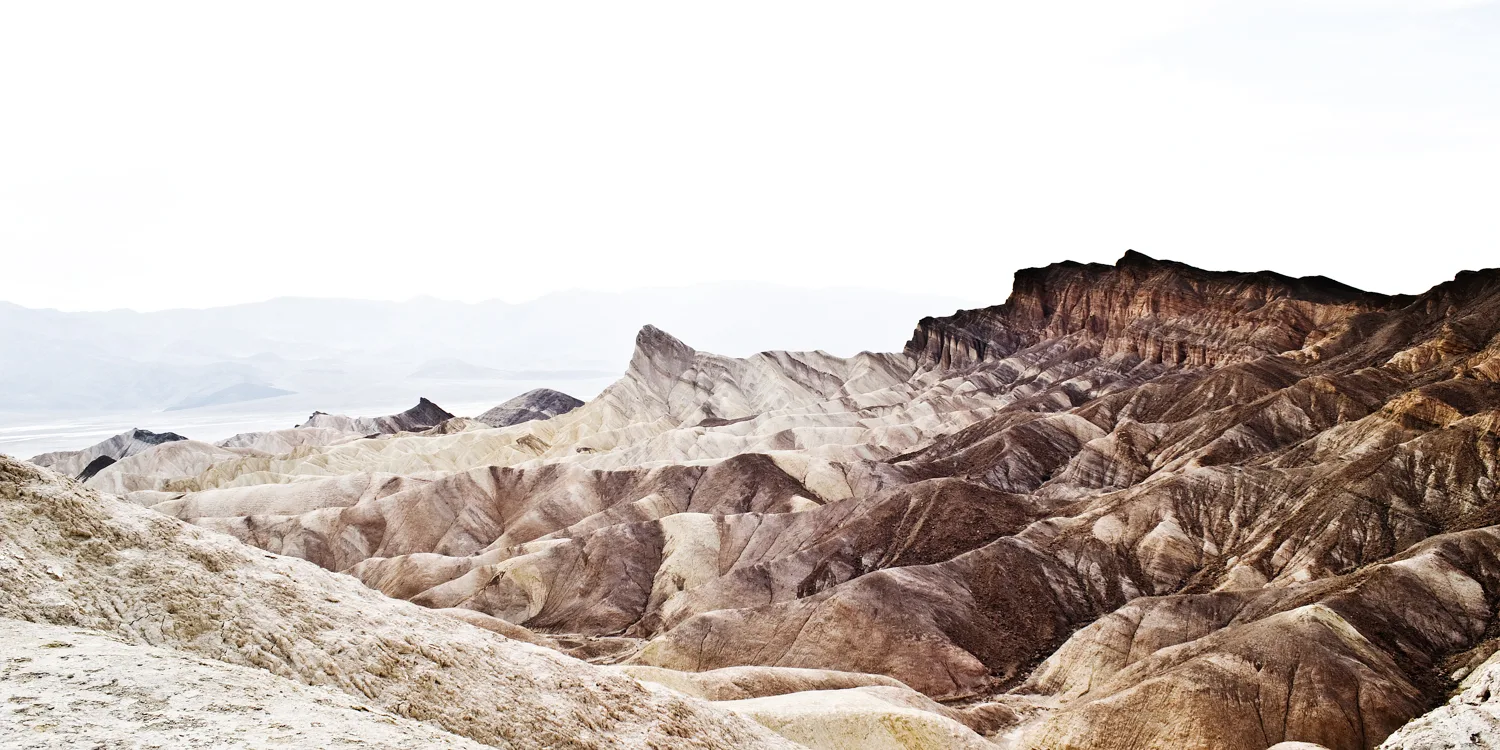 Eroded badlands and Manly Beacon at Zabriskie Point, Death Valley National Park — US West Coast, panoramic fine art landscape photography by Janina Laszlo