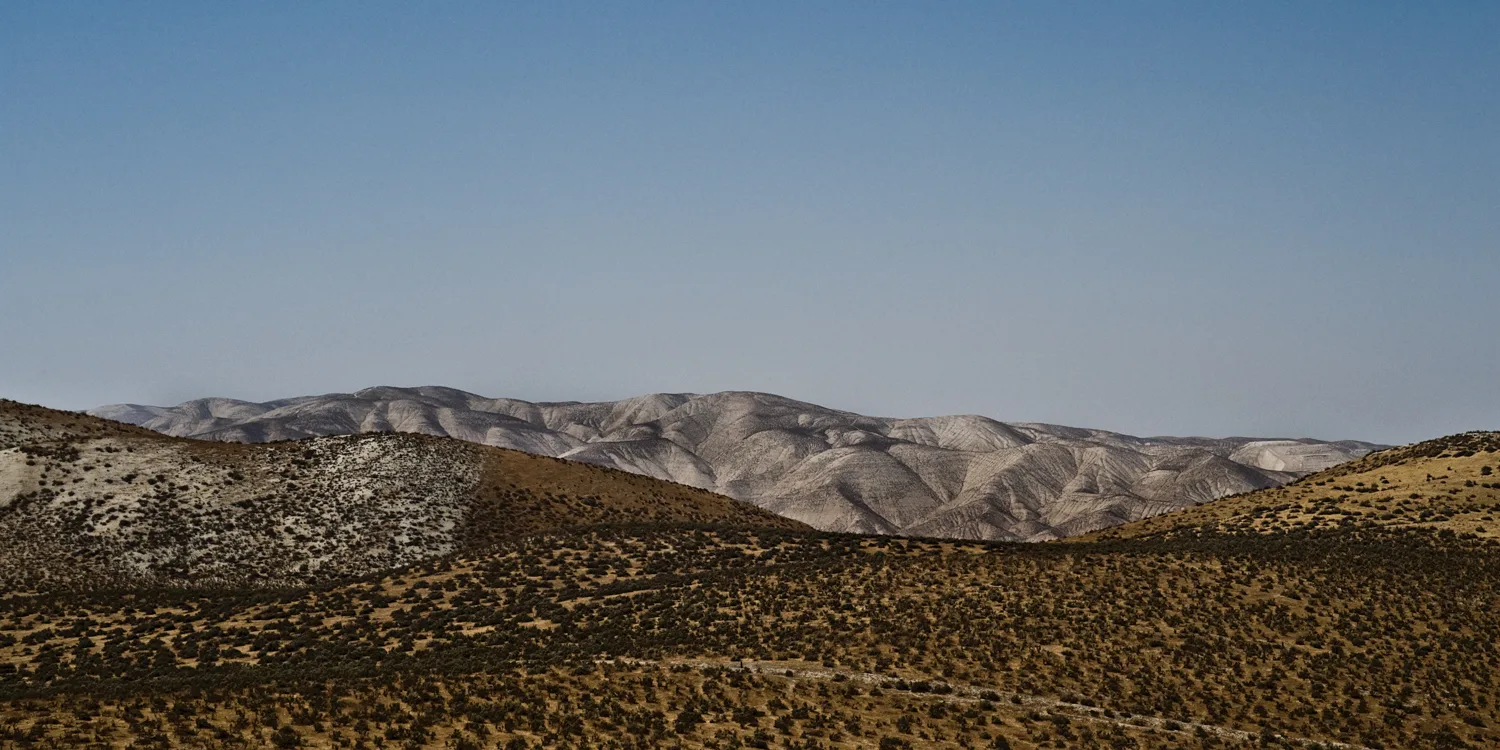 Rolling sagebrush hills before pale eroded mountains, California — US West Coast, panoramic fine art landscape photography by Janina Laszlo