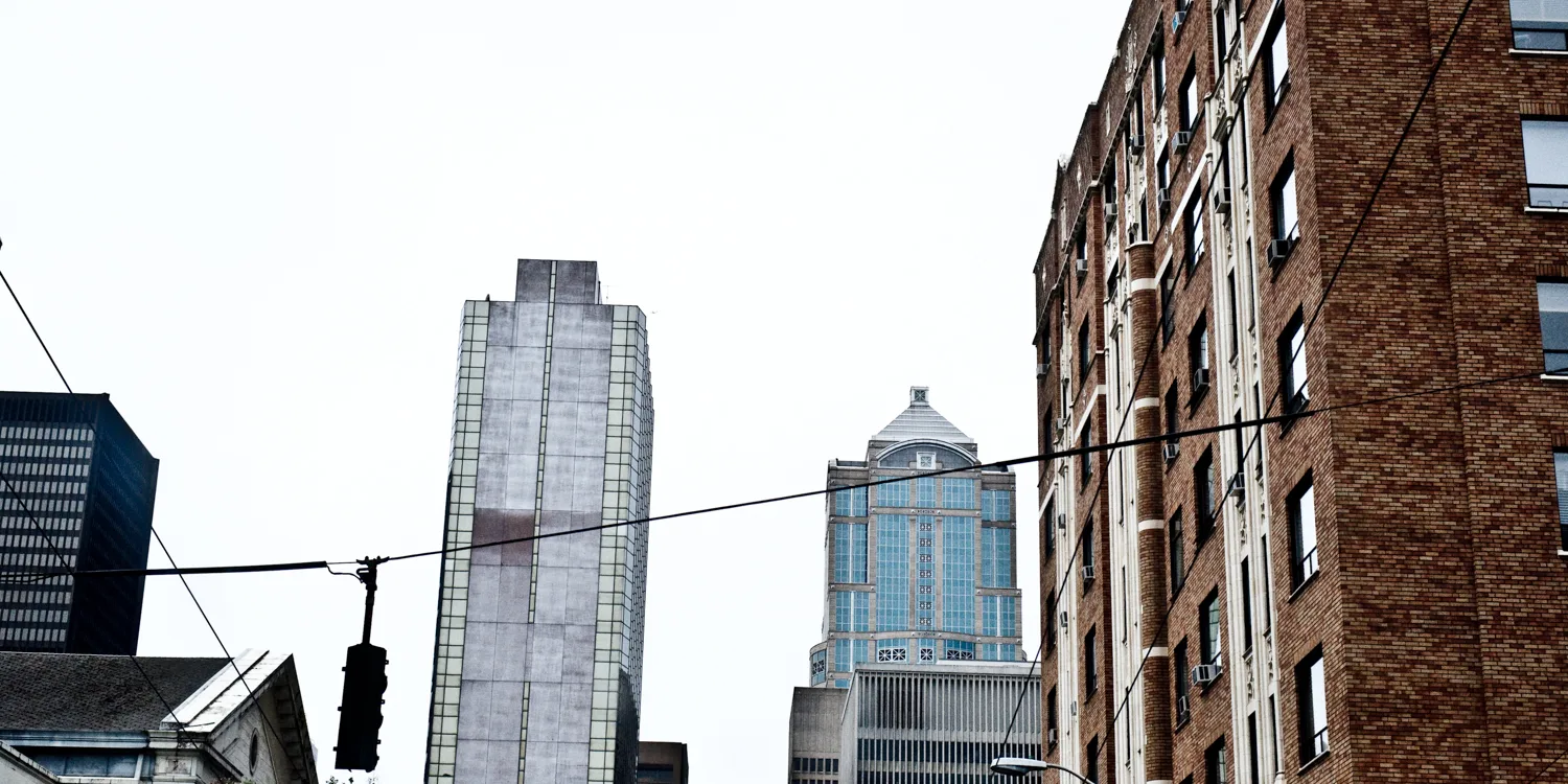 Downtown Seattle high-rises seen from a street with traffic light and wires, Washington — US West Coast, panoramic fine art landscape photography by Janina Laszlo