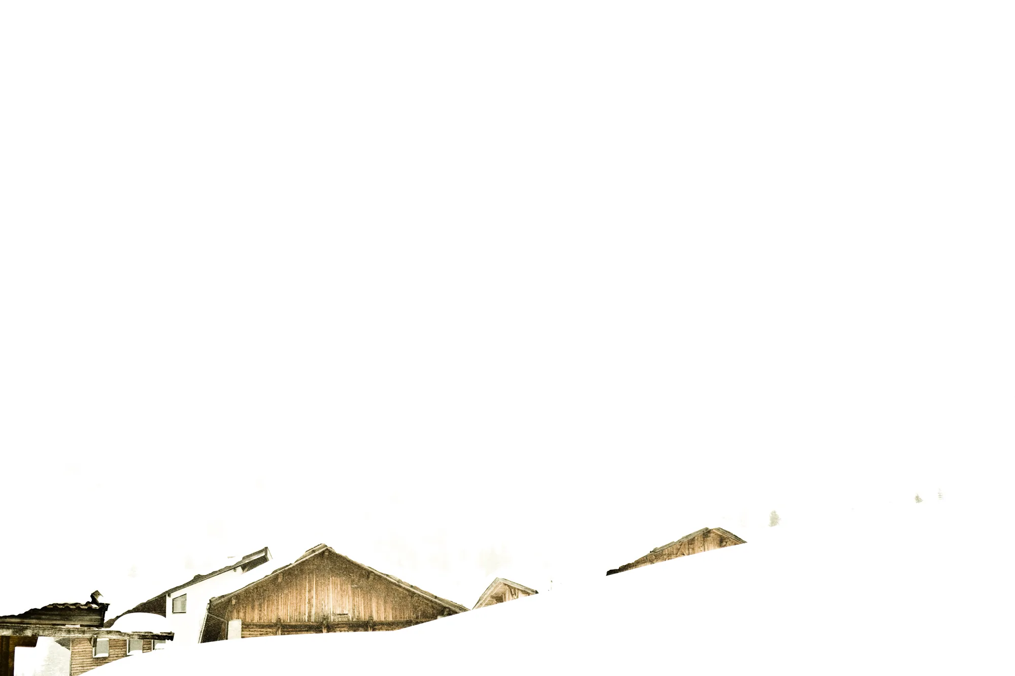 Wooden hut roofs half buried in deep snow, Ziroger Alm — South Tyrol, fine art winter photography by Janina Laszlo