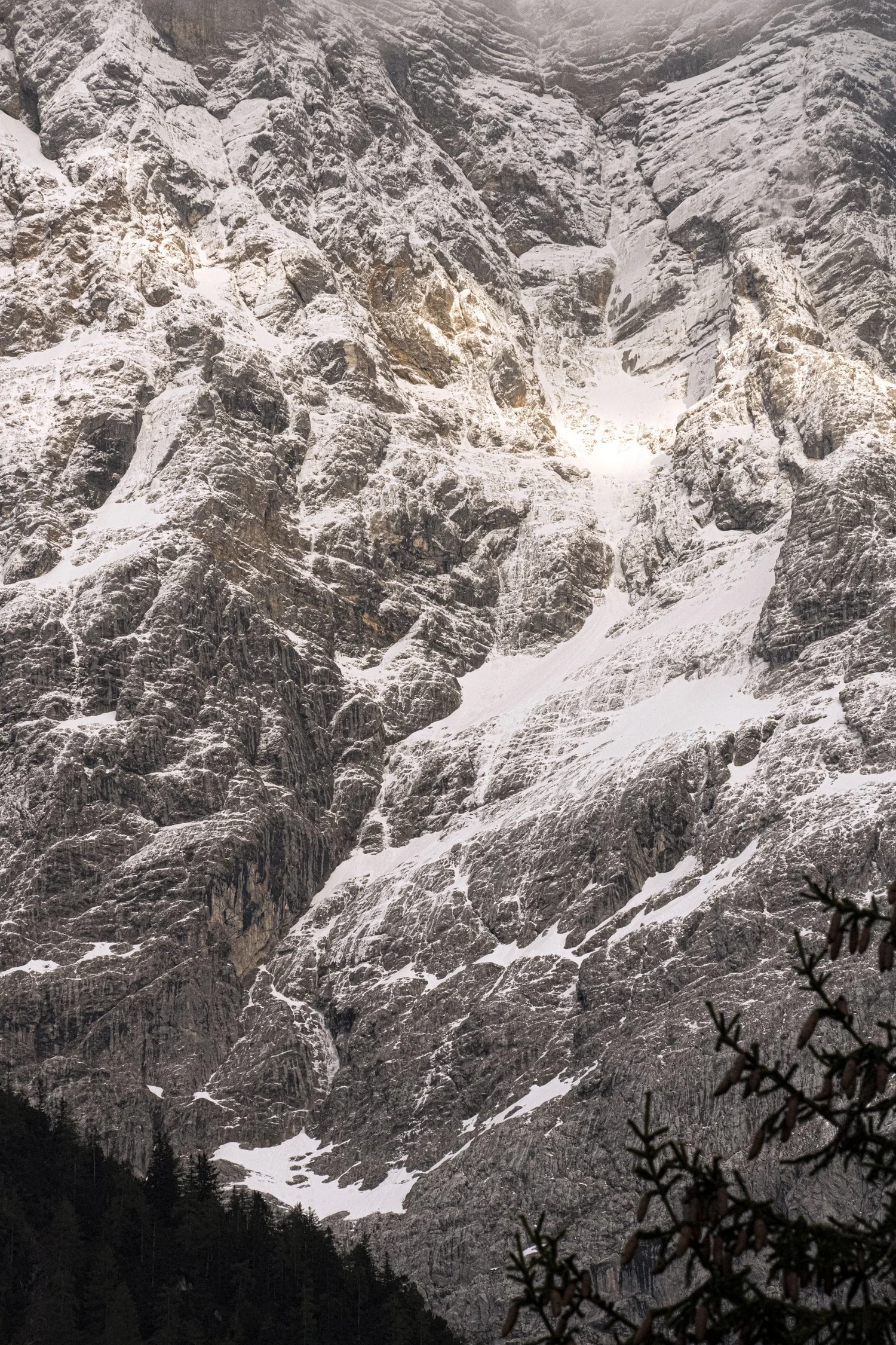 Snow-dusted rock face of the Zugspitze massif seen from Zugspitz Resort — campaign photography by Janina Laszlo, Munich