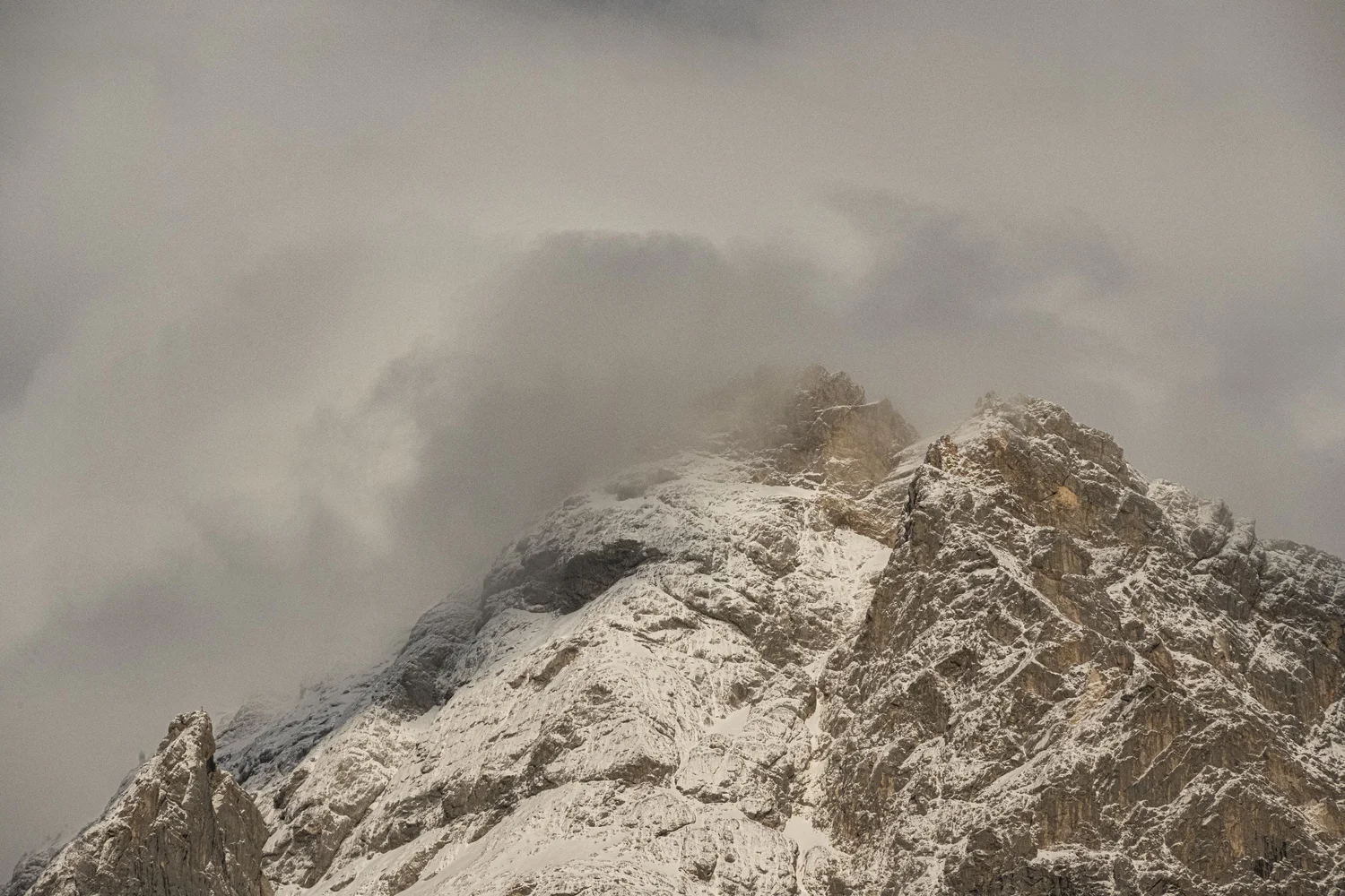 Zugspitze summit emerging from the clouds, Zugspitz Resort — campaign photography by Janina Laszlo, Munich